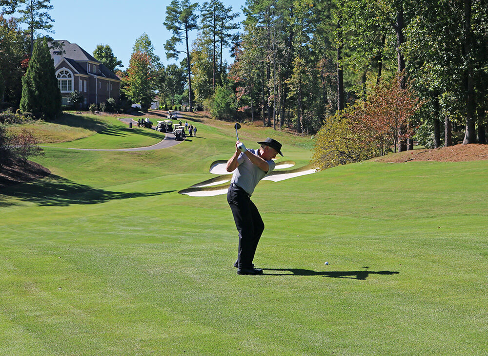 Greg Norman hits a shot at the renovated TPC Sugarloaf